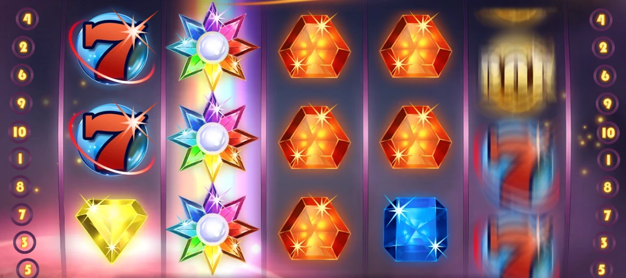 Starburst with an expanded Wild covering all three positions on reel 2 while reel 5 is still spinning